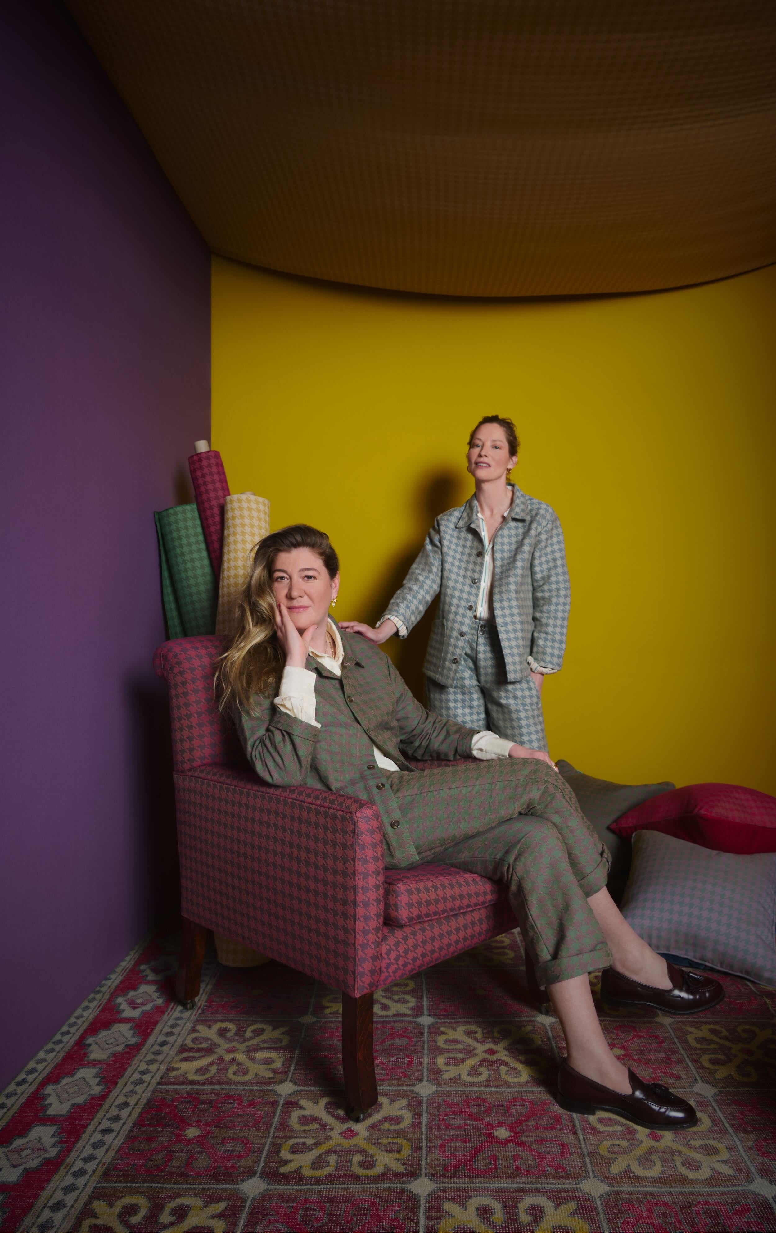 Flora wears work jacket and work trousers in Heather Walter houndstooth, Sienna wears work jacket and dutch trouser in duck egg