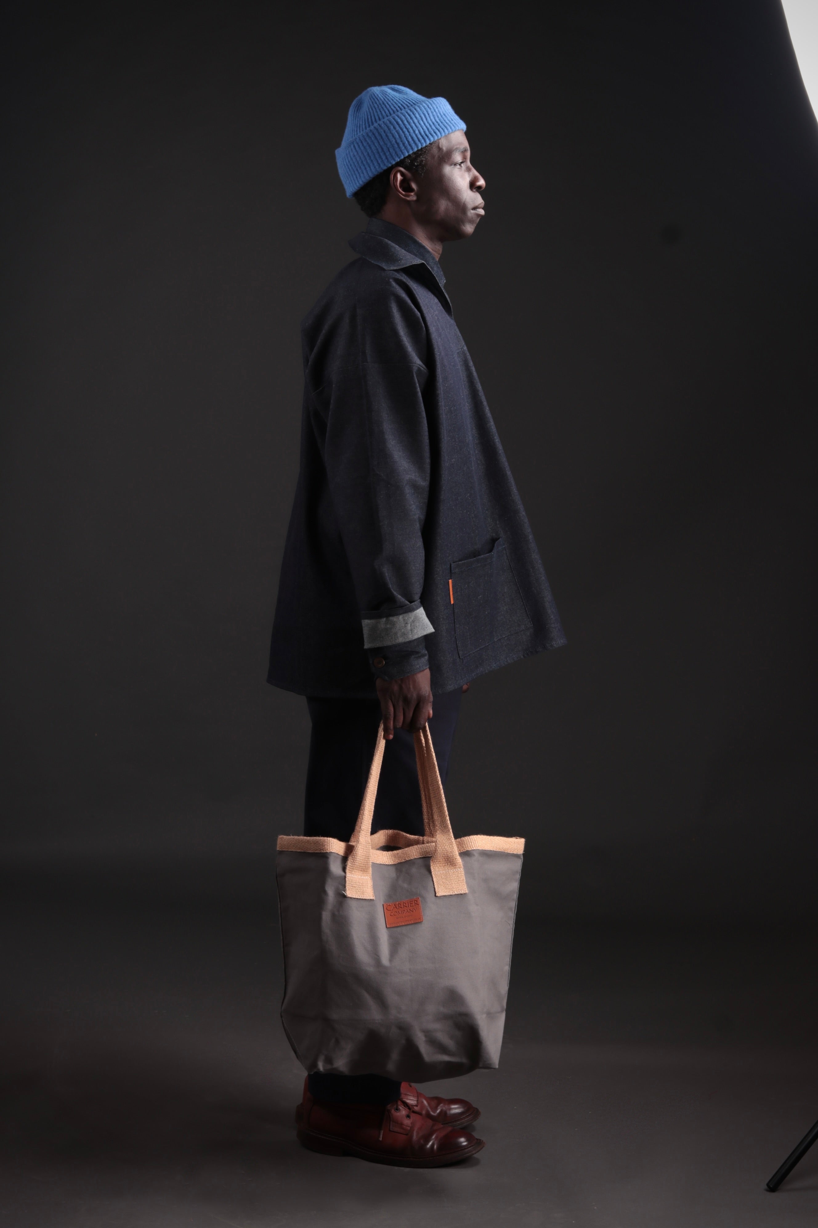 Man Carries Carrier Company Sturdy Bag in Dove Grey