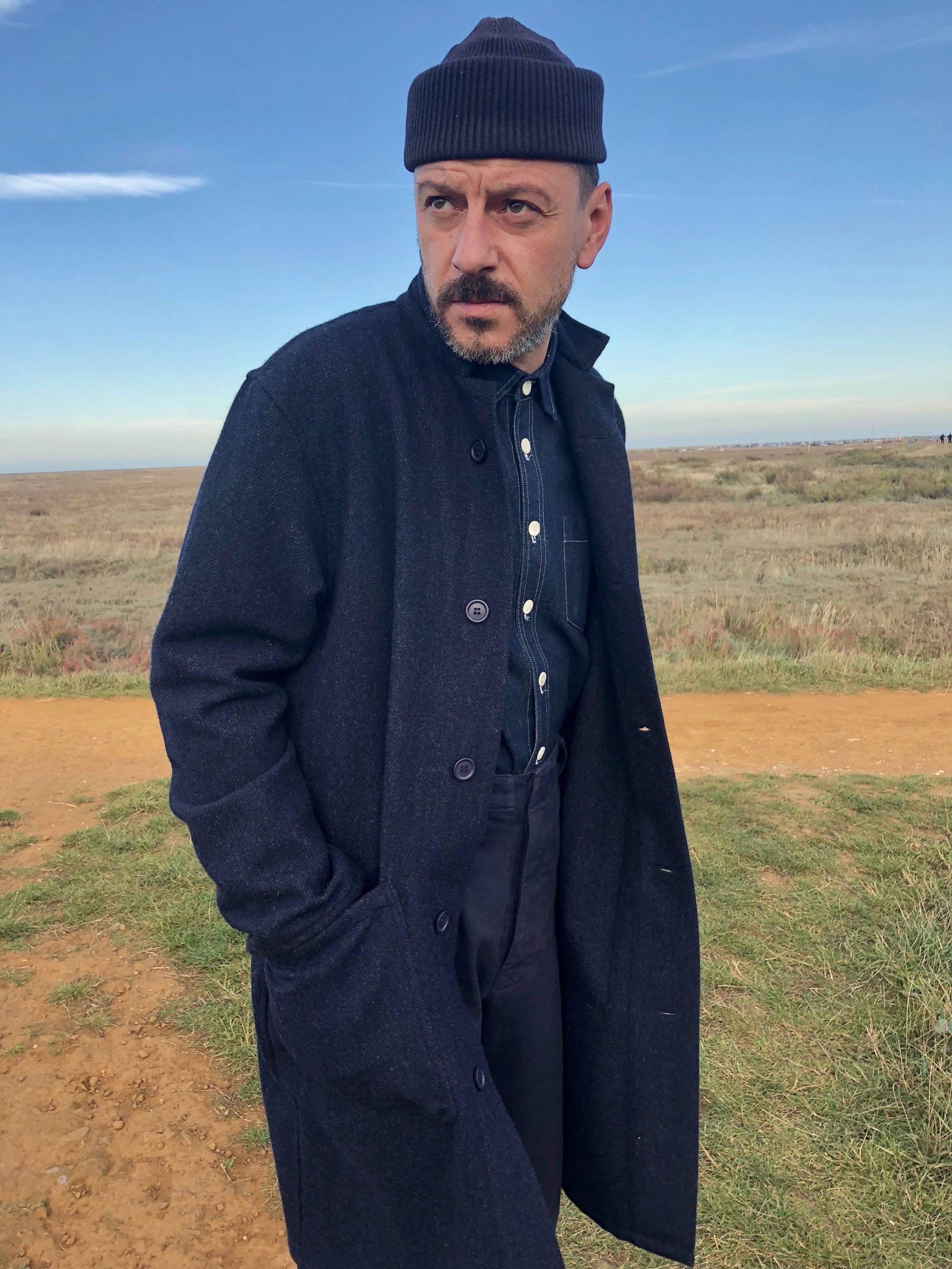 man wearing Carrier Company Wool Coat in Navy with Wool Hat and Denim Collar Shirt